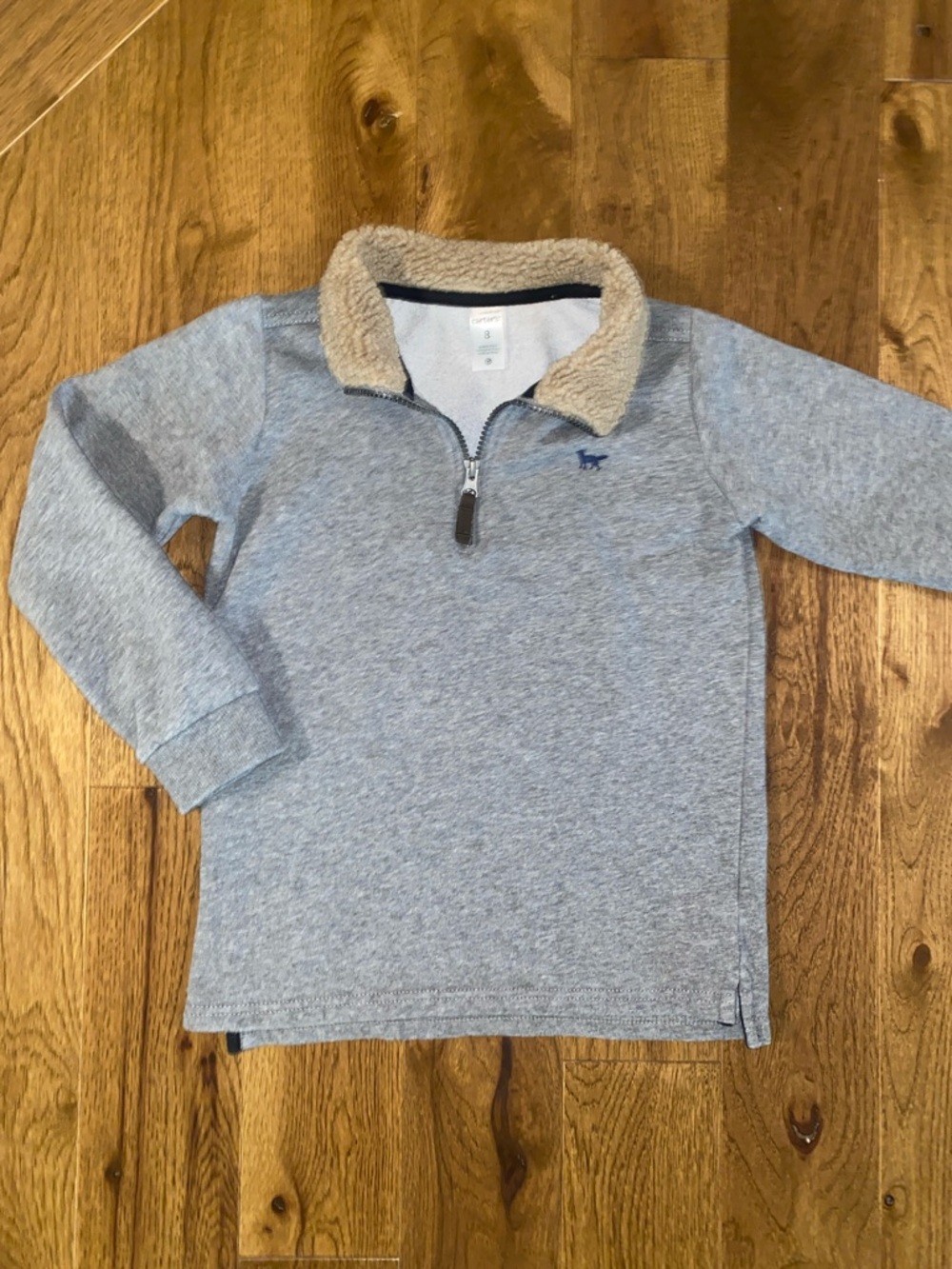 Boys size 8 Carter’s 1/4 zip long sleeved sweater with fleece collar.
